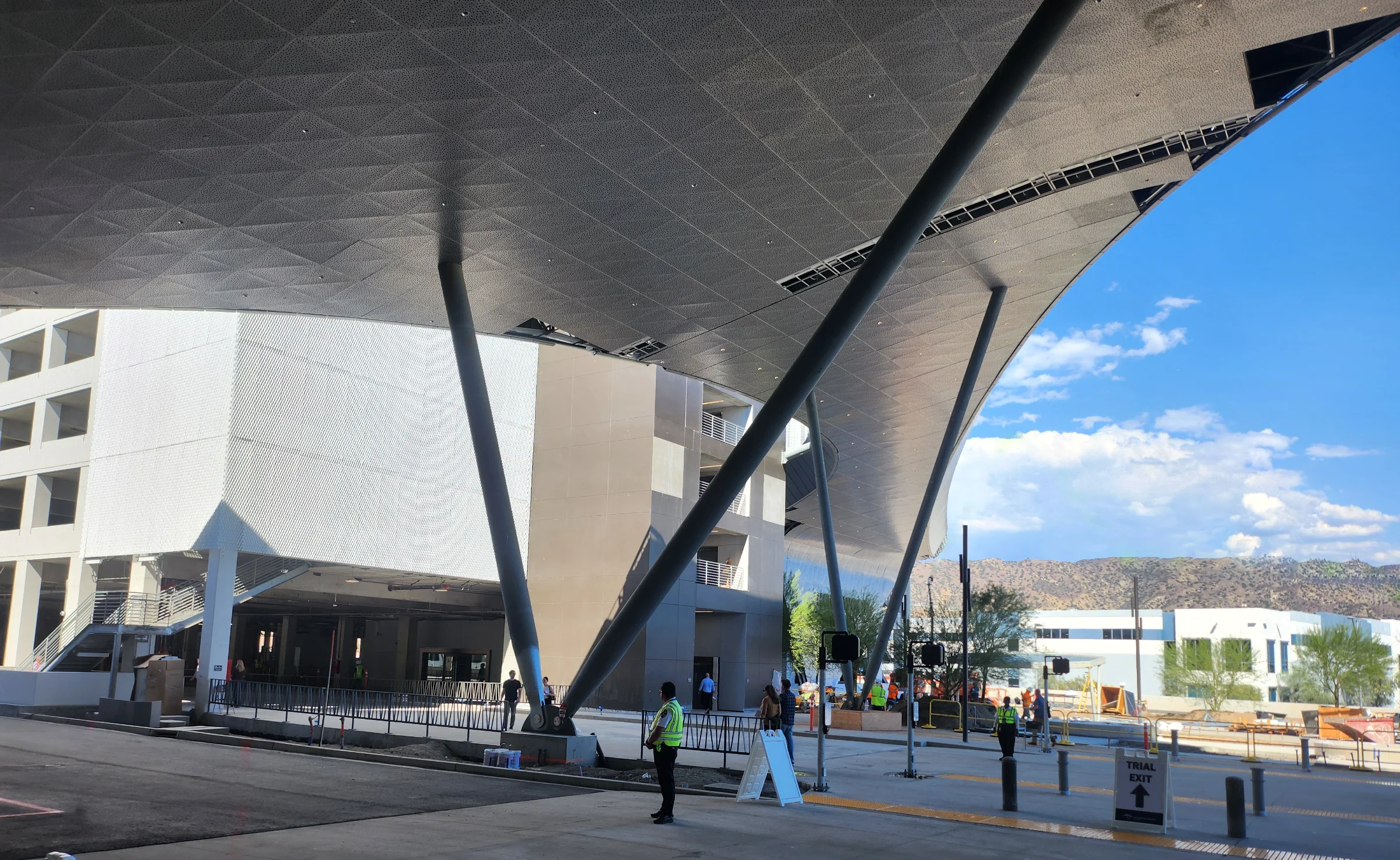 The terminal's sweeping canopy roofline against the San Gabriel Mountains and a clear blue sky